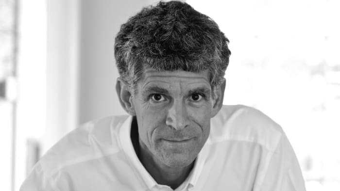 Portland creative life coach Mark Newton in his design studio